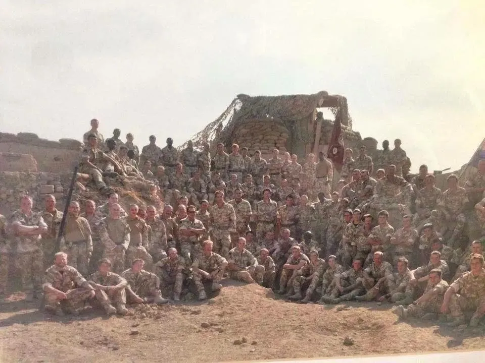 A full company photo in desert kit