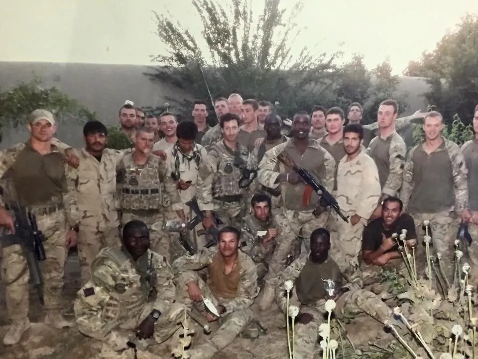 Alex with his unit in the field